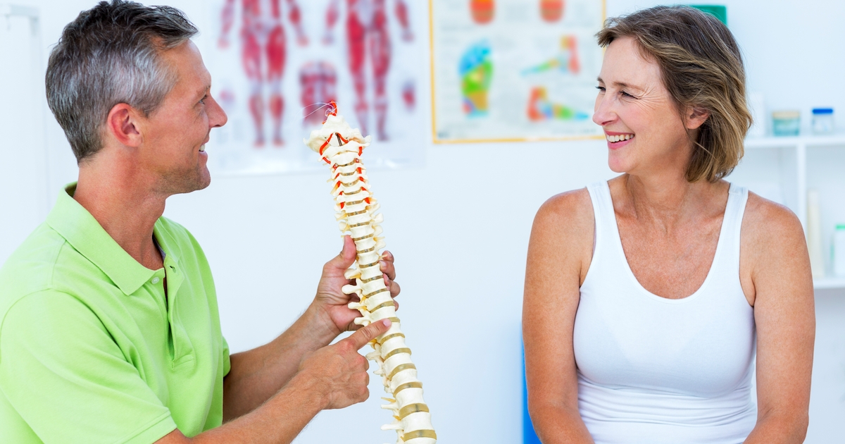 Doctor showing anatomical spine